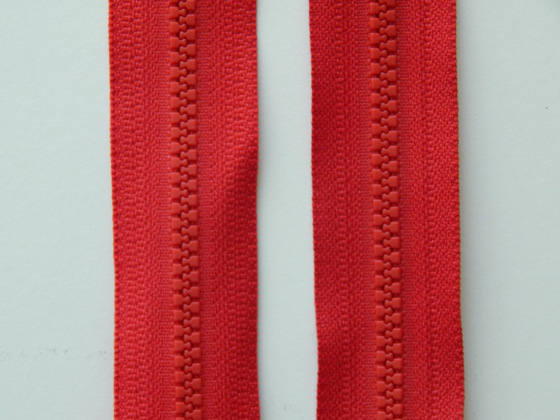 bright red plastic zipper