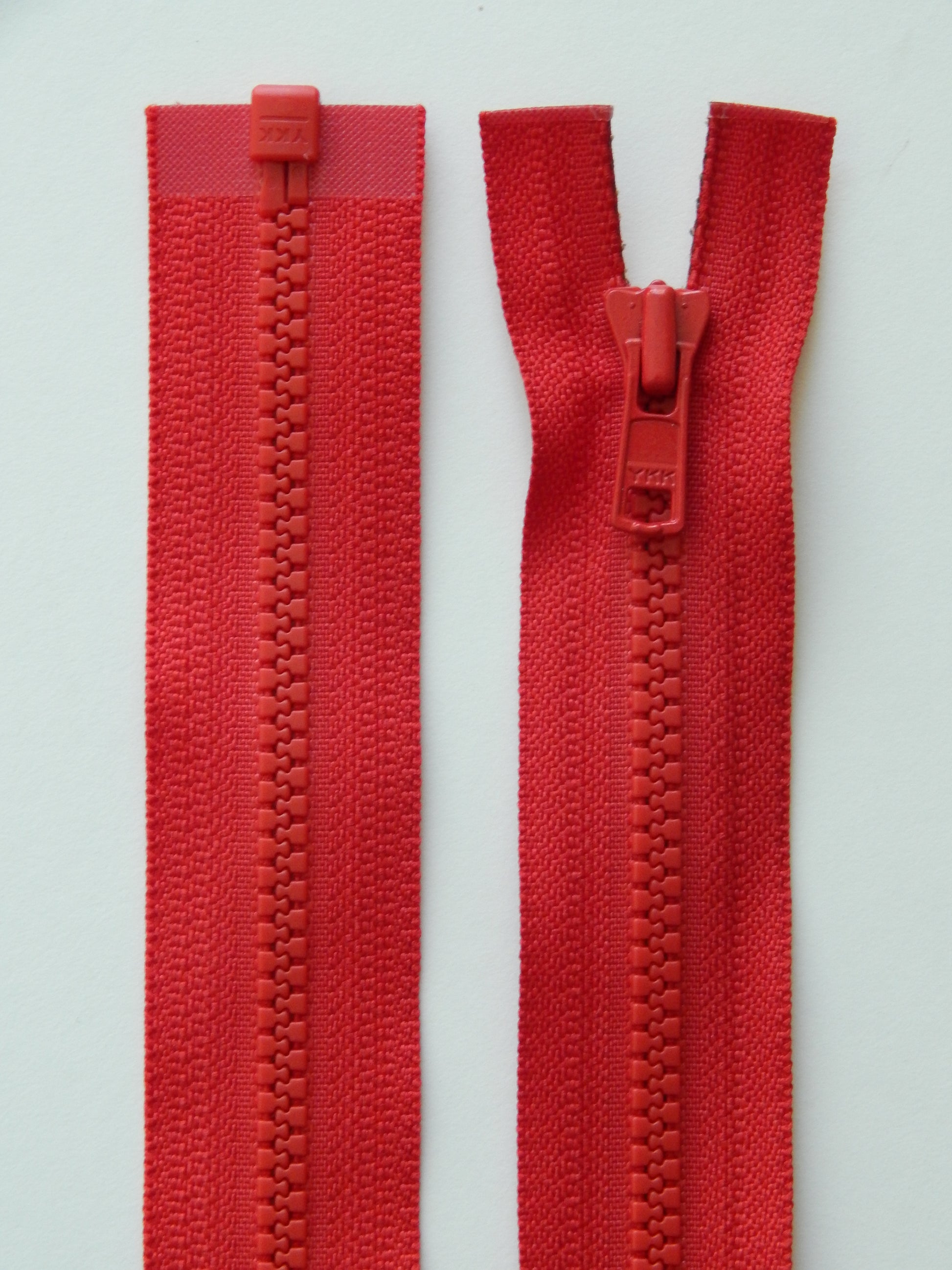 red molded plastic sport separating jacket zipper