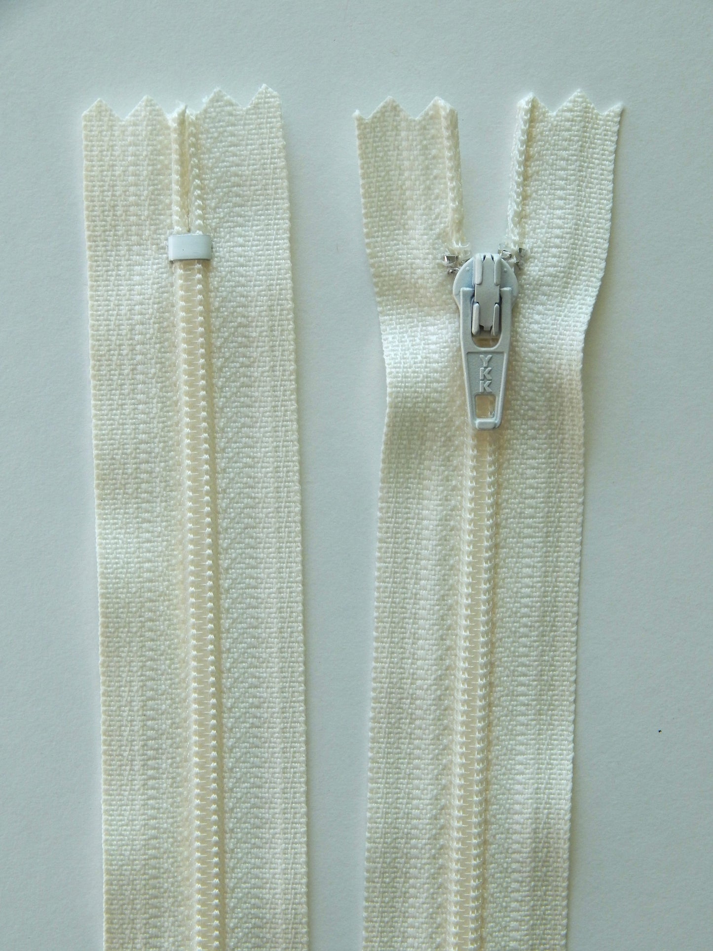 off white plastic nonseparating skirt zipper