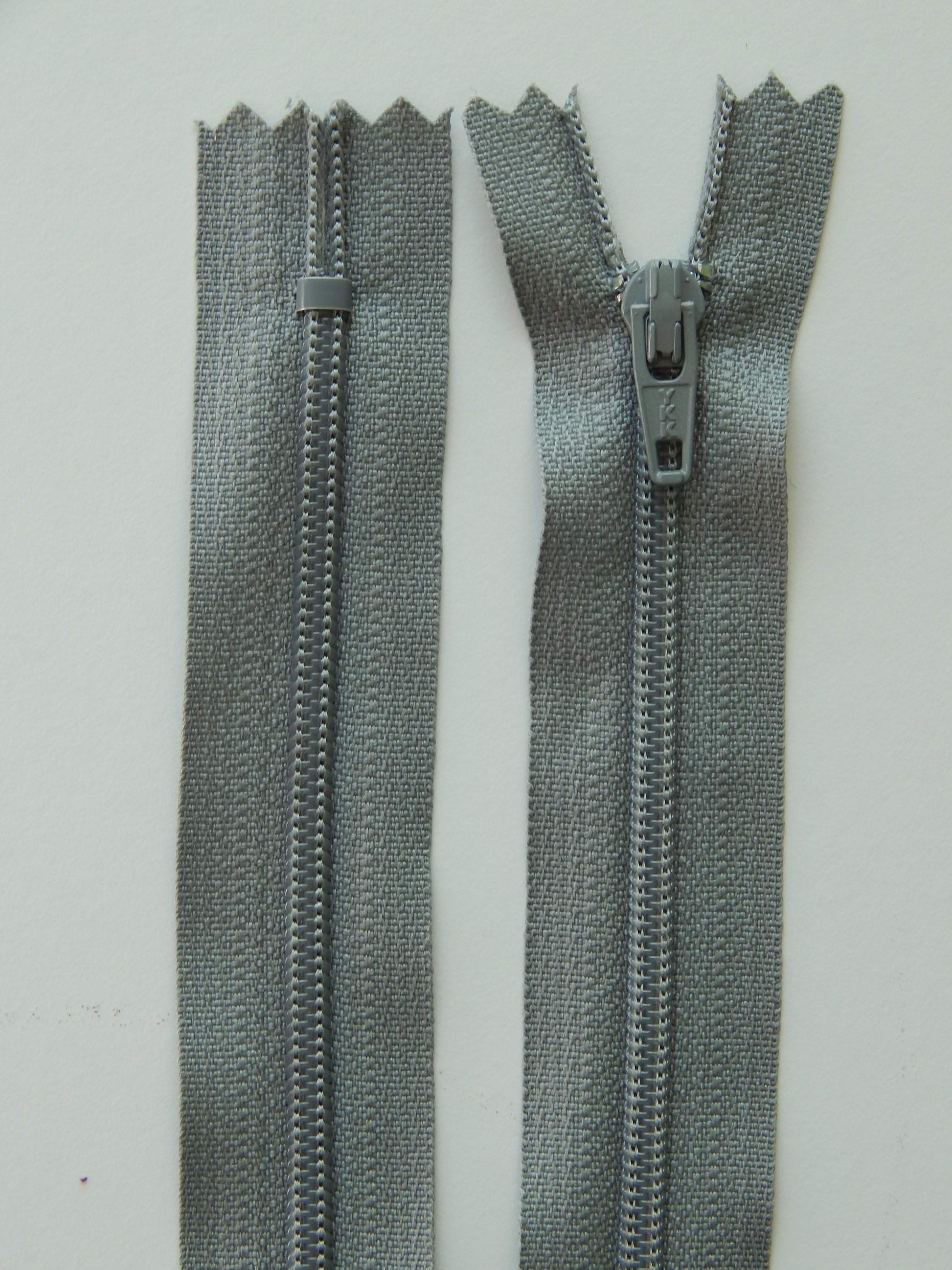grey plastic nonseparating skirt zipper
