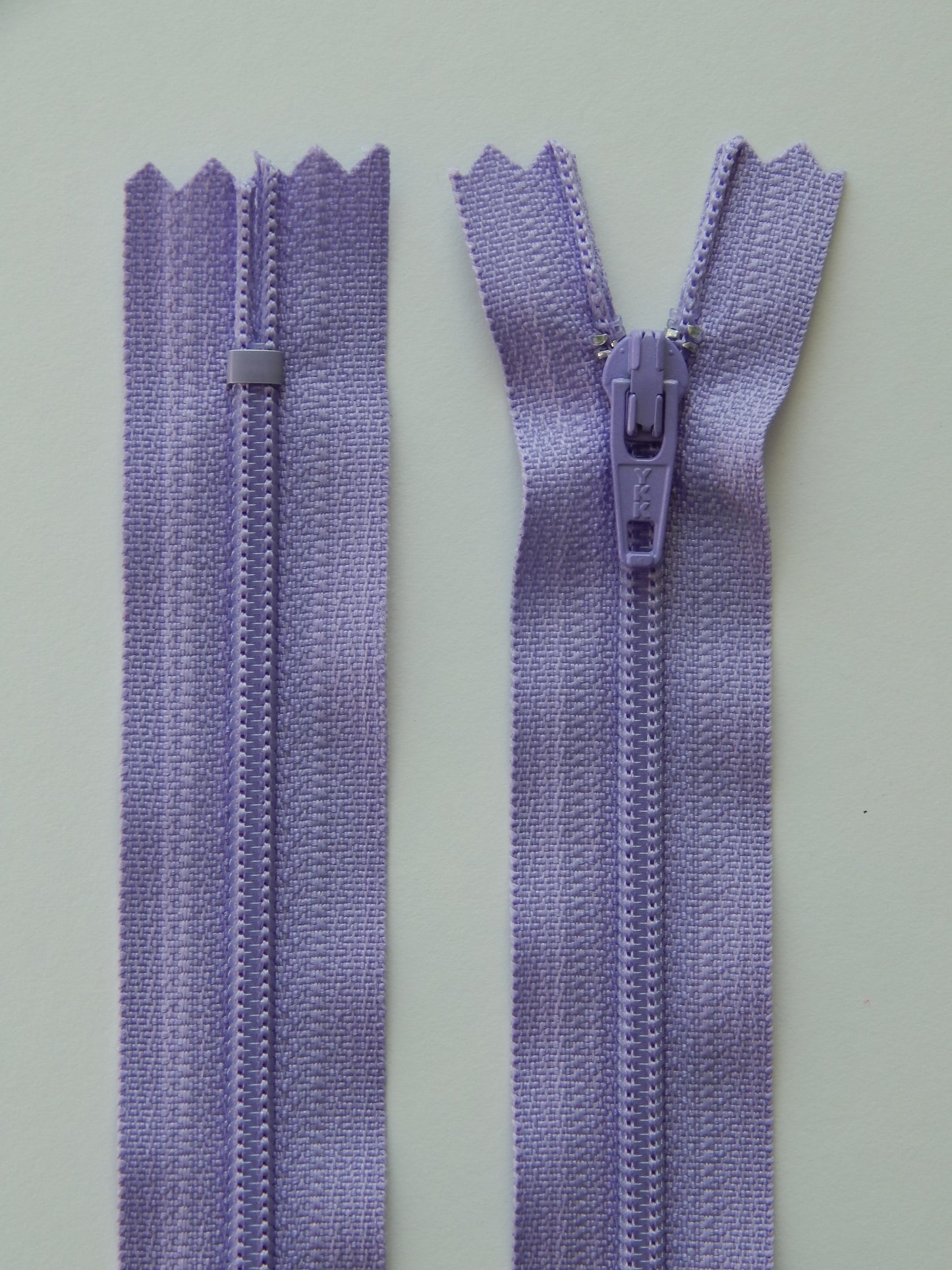 light purple plastic nonseparating skirt zipper