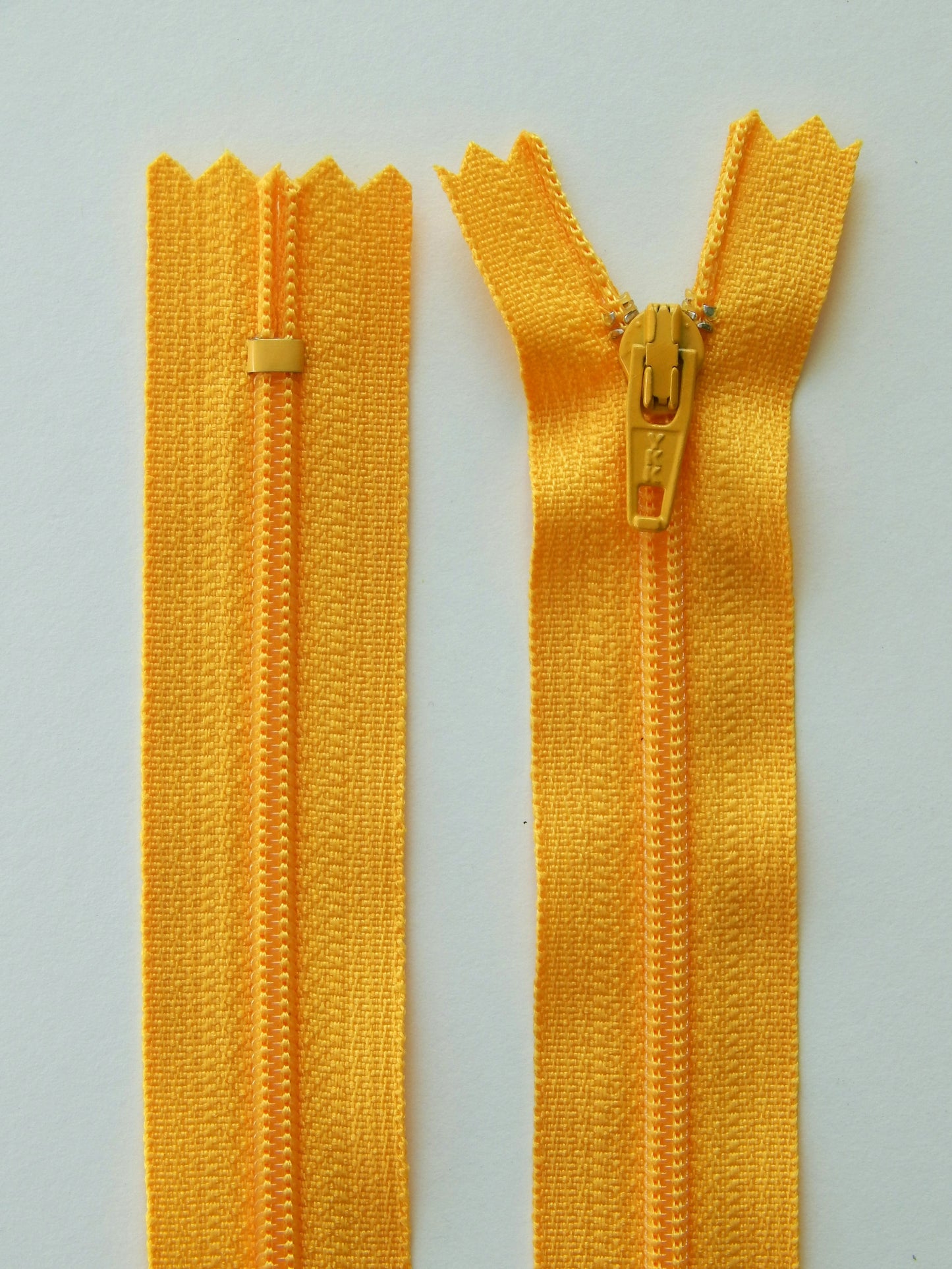 dark yellow plastic nonseparating skirt zipper