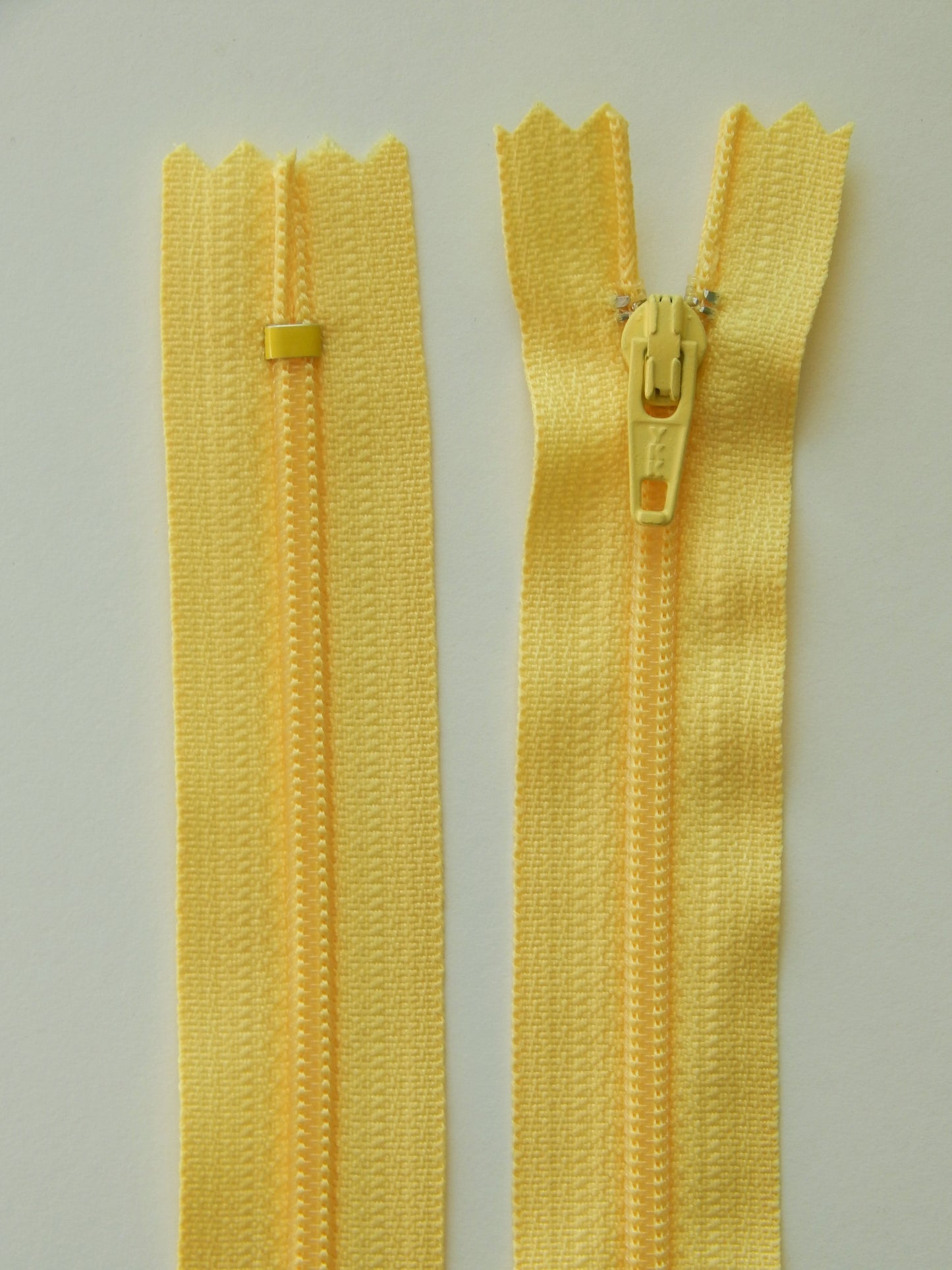 pastel yellow plastic nonseparating skirt zipper