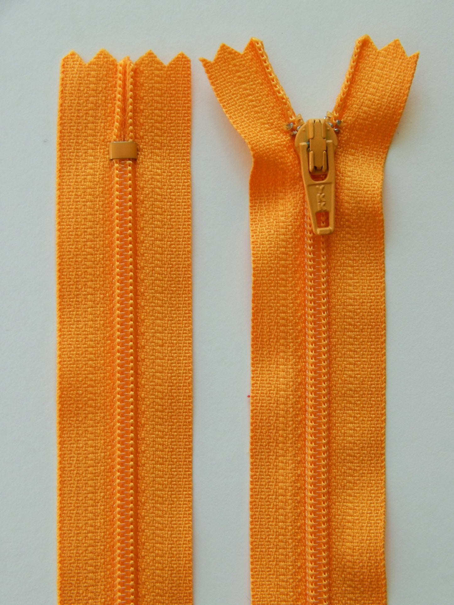 orange plastic nonseparating skirt zipper