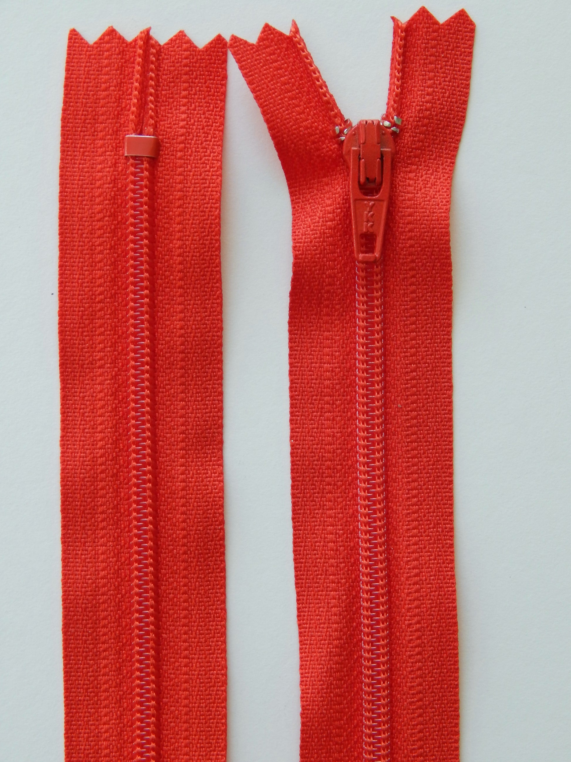 fire red plastic nonseparating skirt zipper