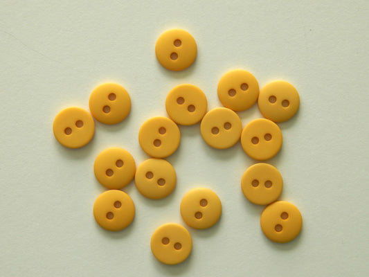 yellow plastic buttons