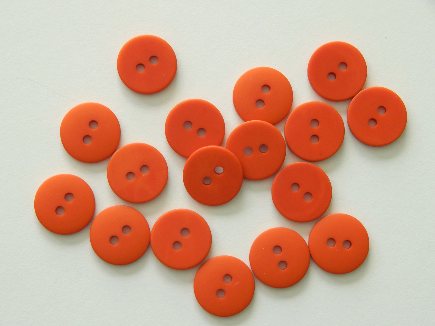 scarlet orange plastic buttons