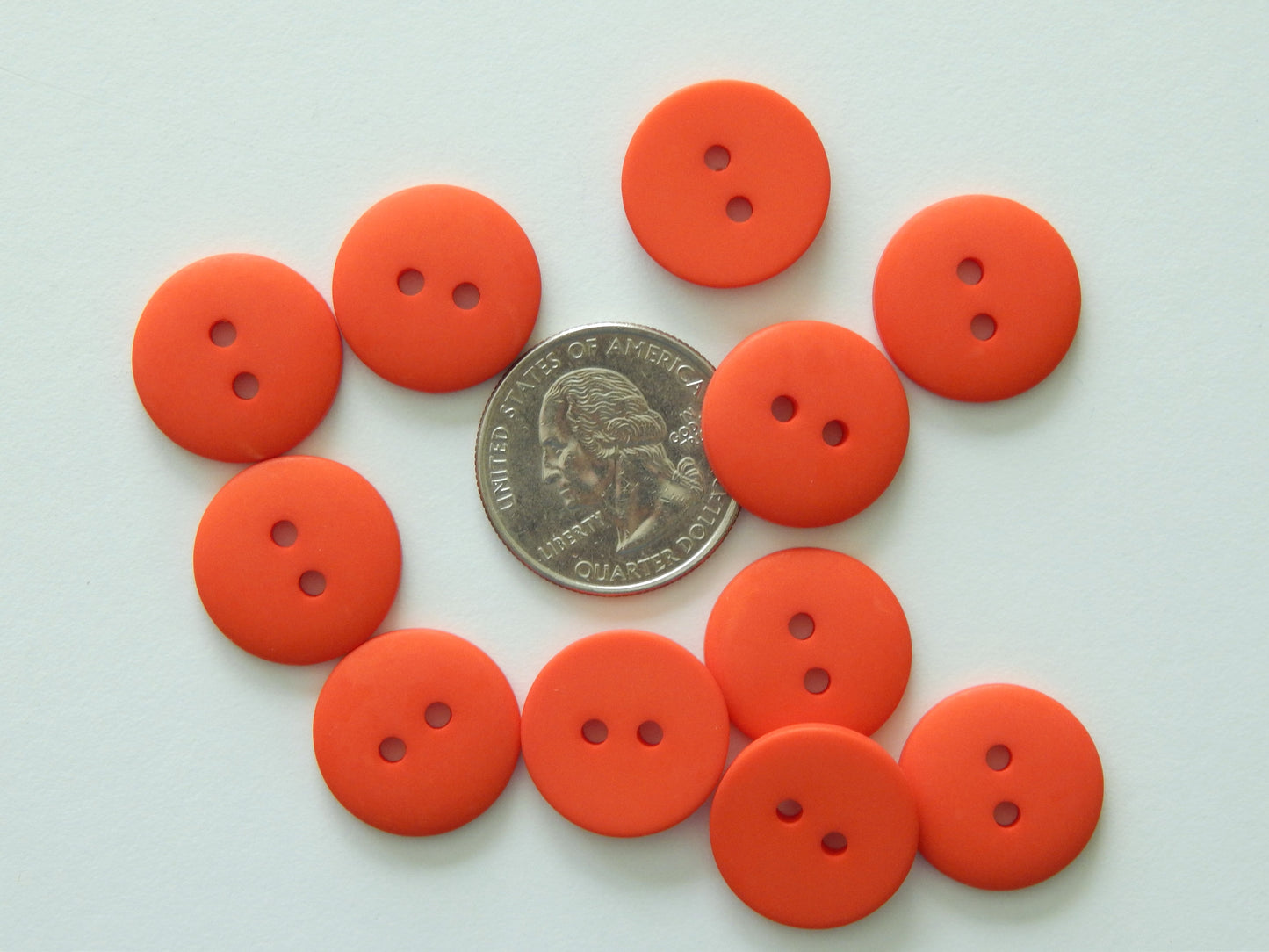 bright orange plastic buttons