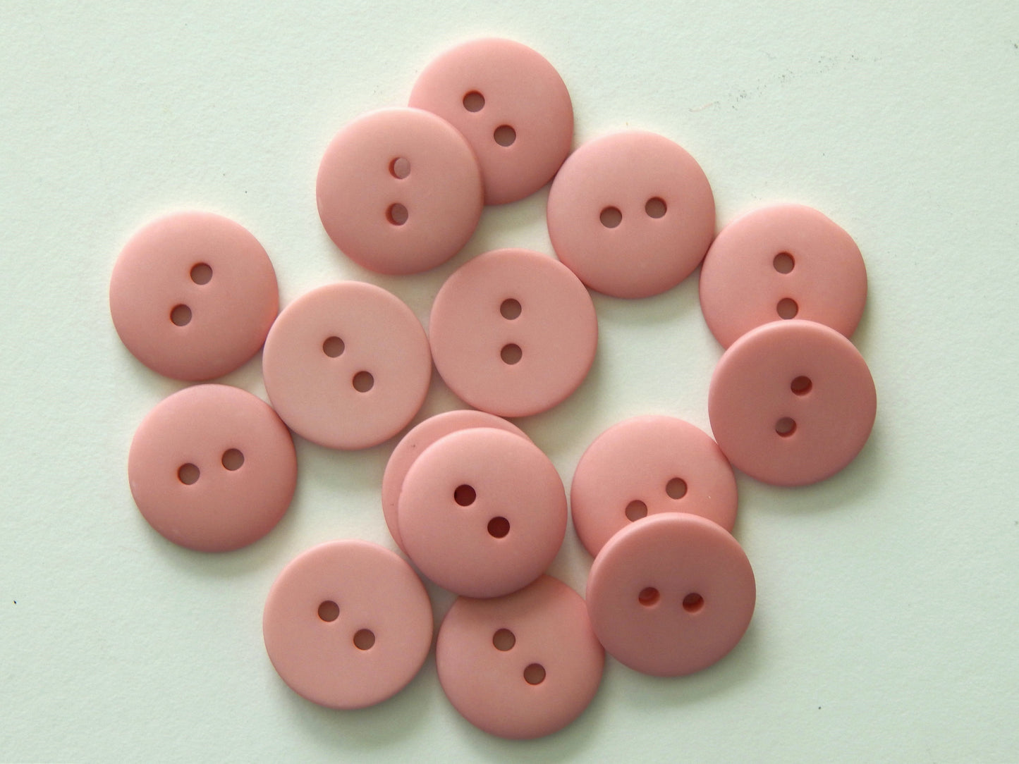 dusty pink plastic buttons