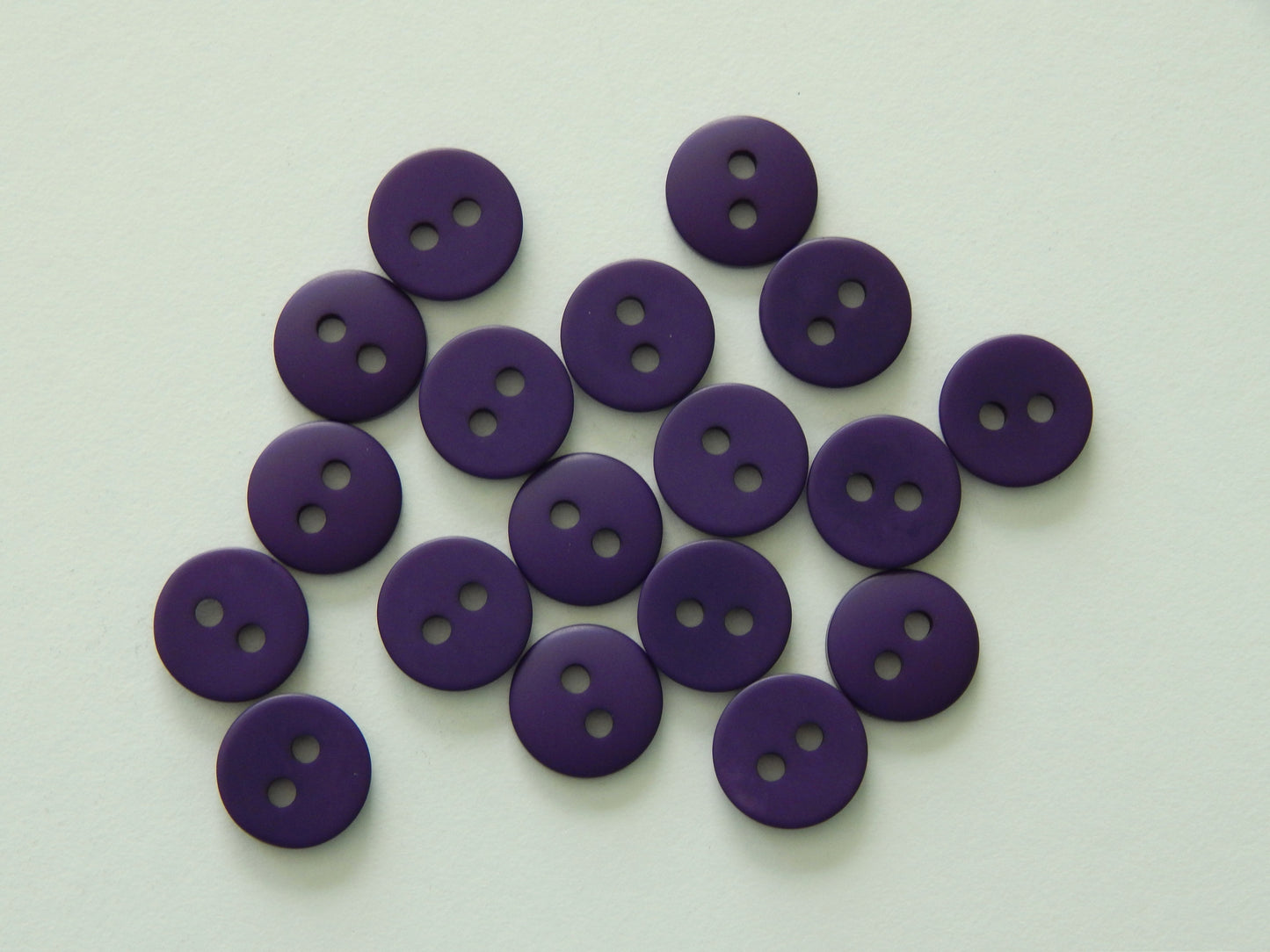 purple plastic buttons