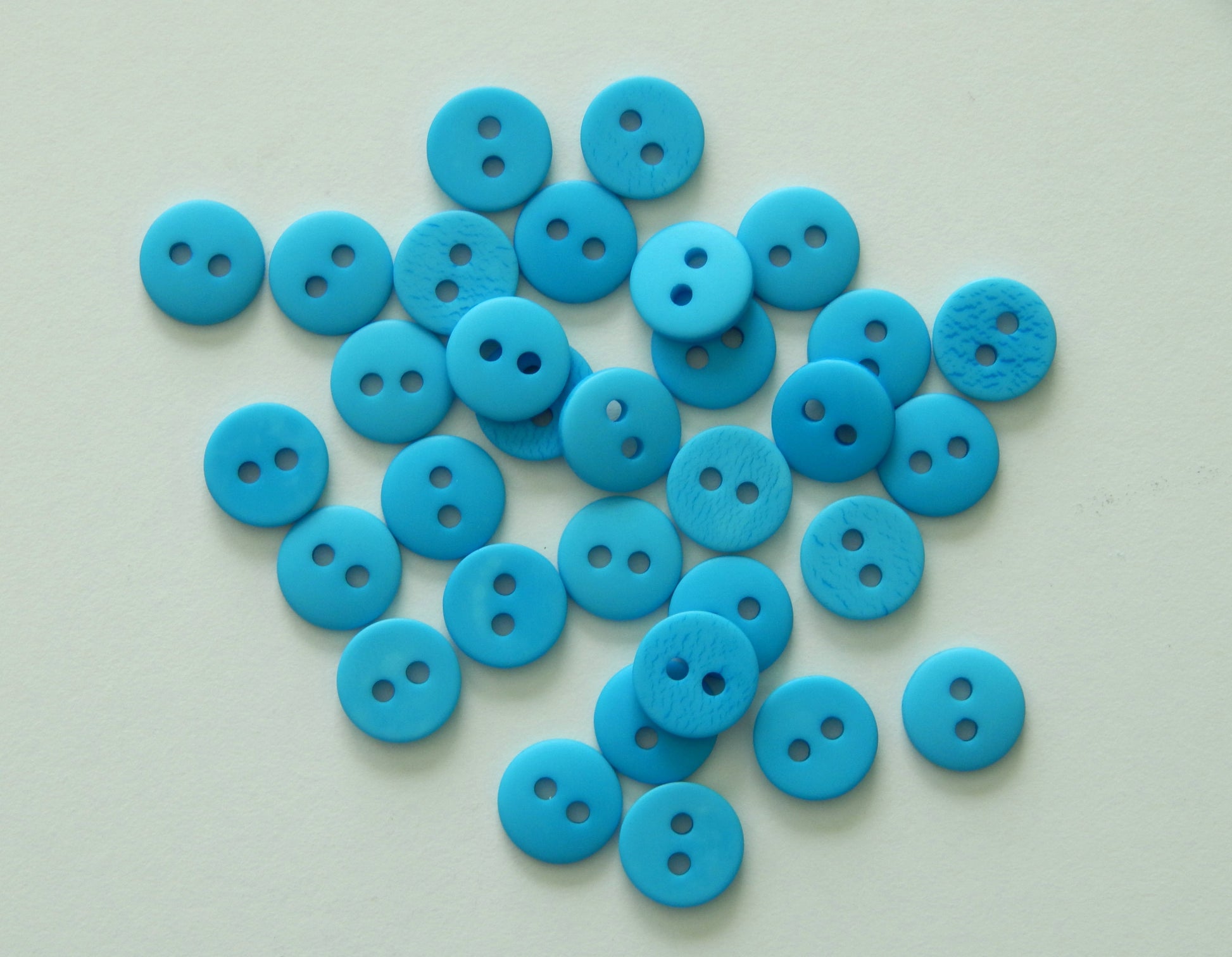 bright blue shirting buttons