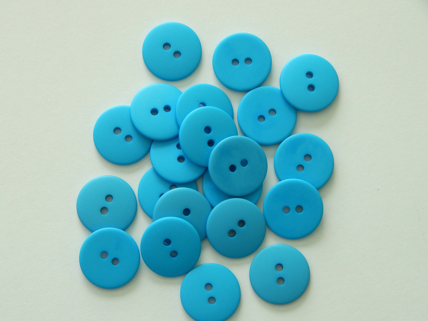 peacock blue plastic buttons