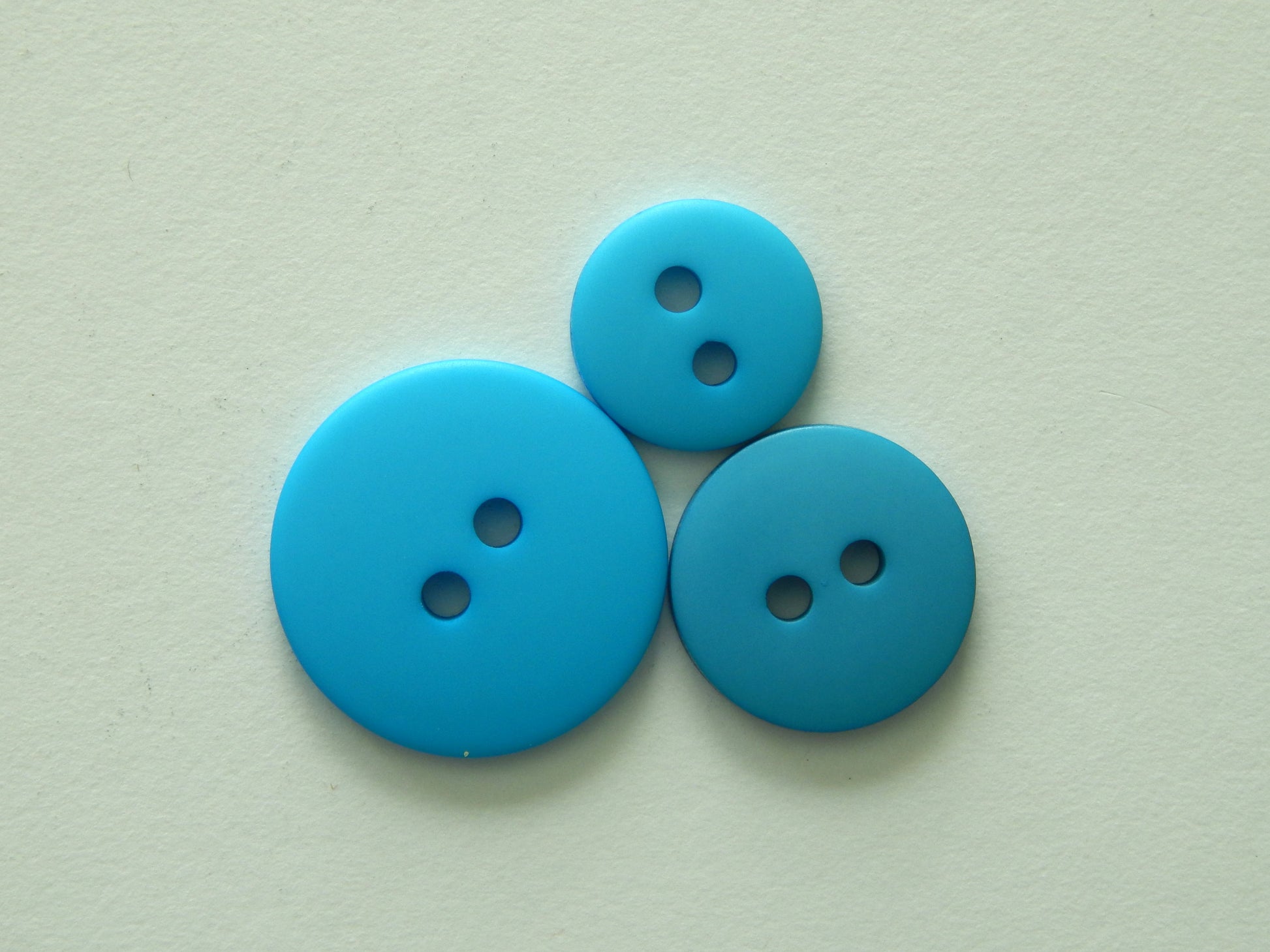 bright blue plastic buttons