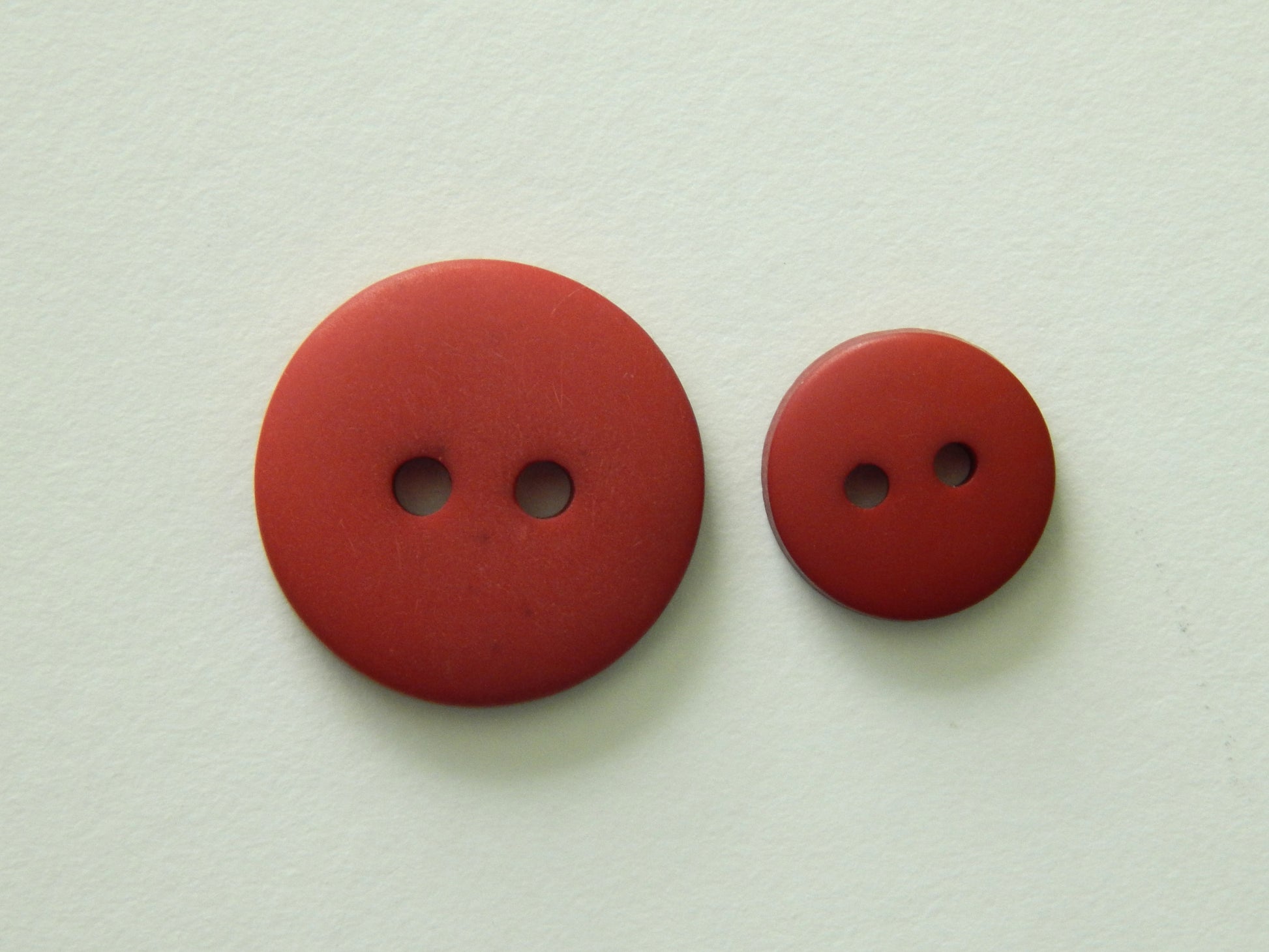 red plastic buttons