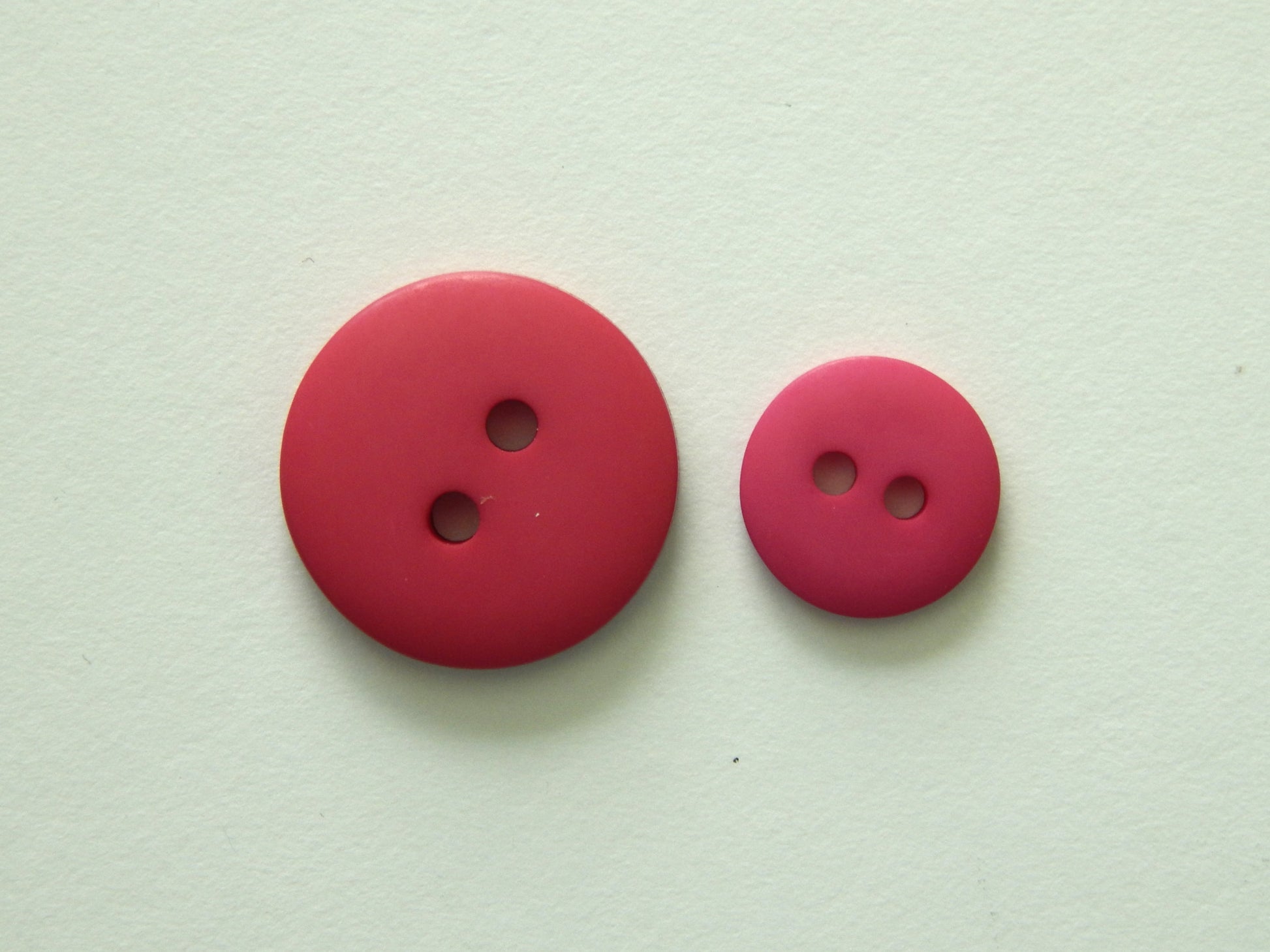 pink plastic shirt buttons