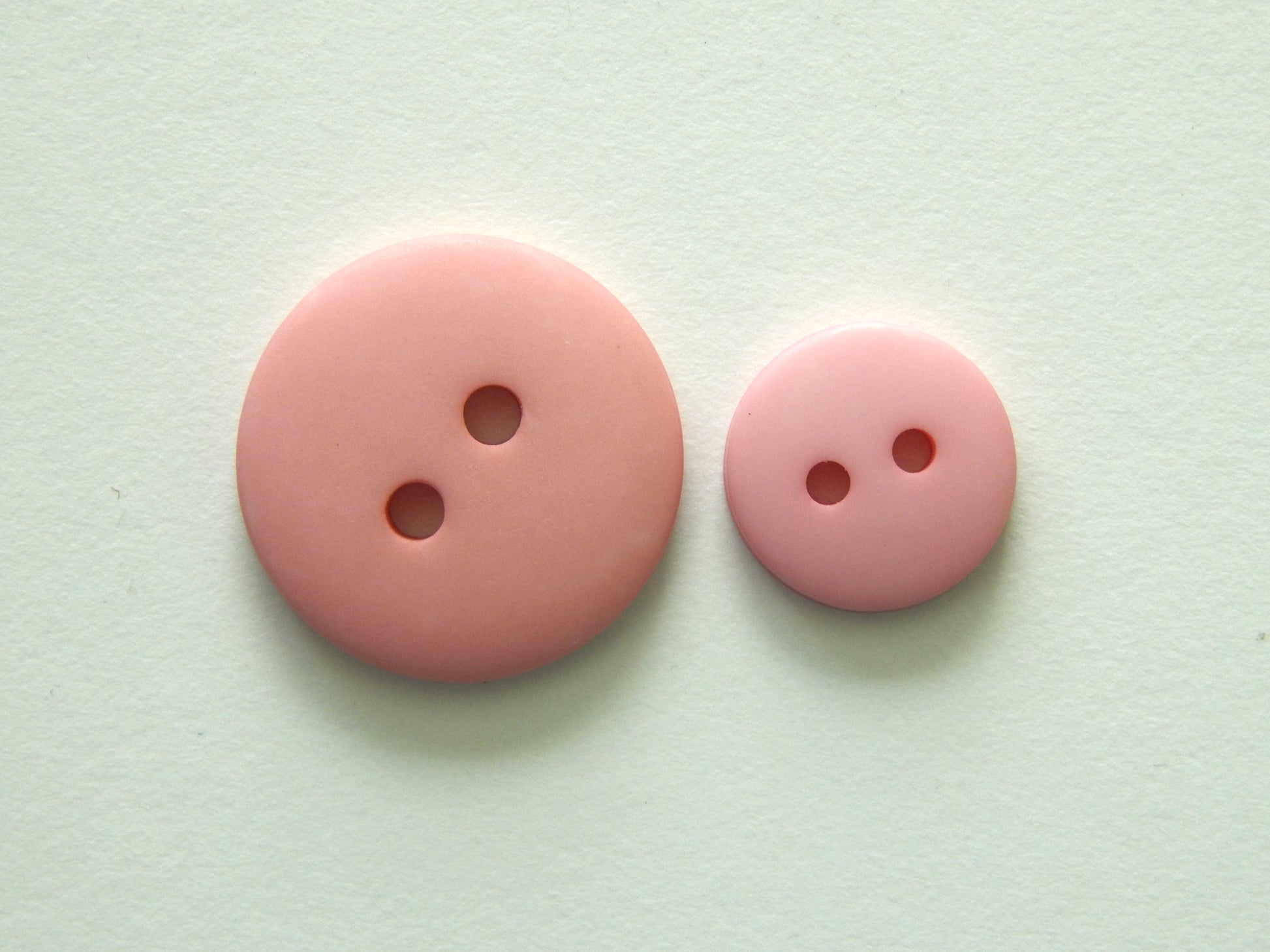pink plastic buttons