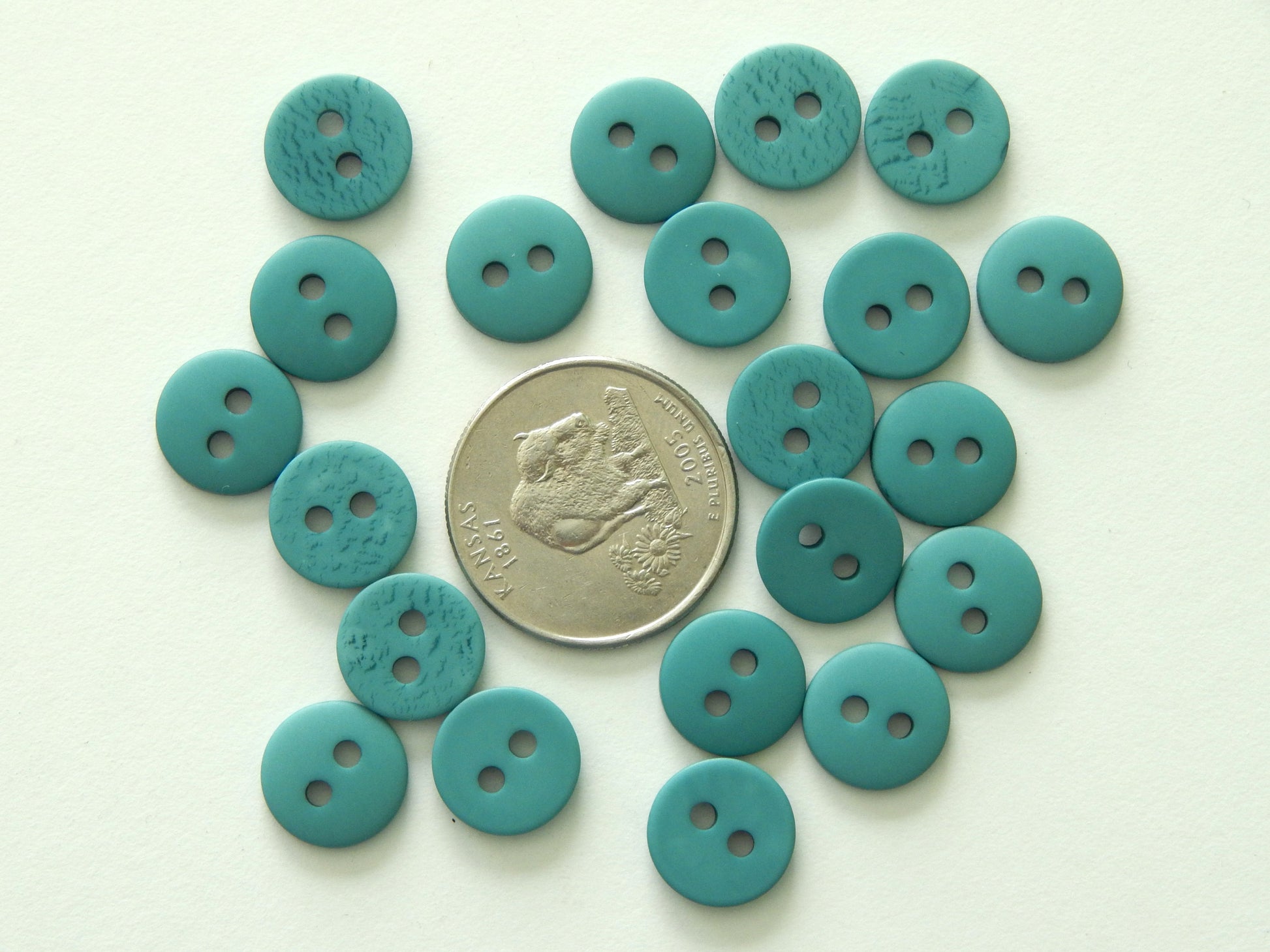 turquoise plastic buttons