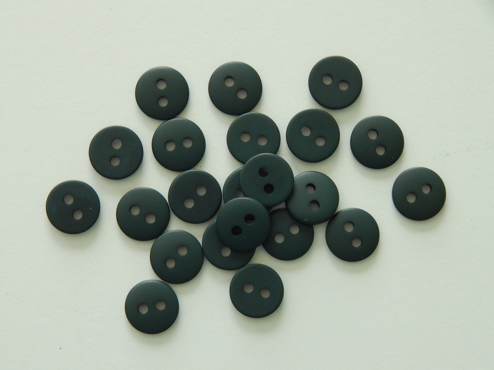 dark green plastic buttons