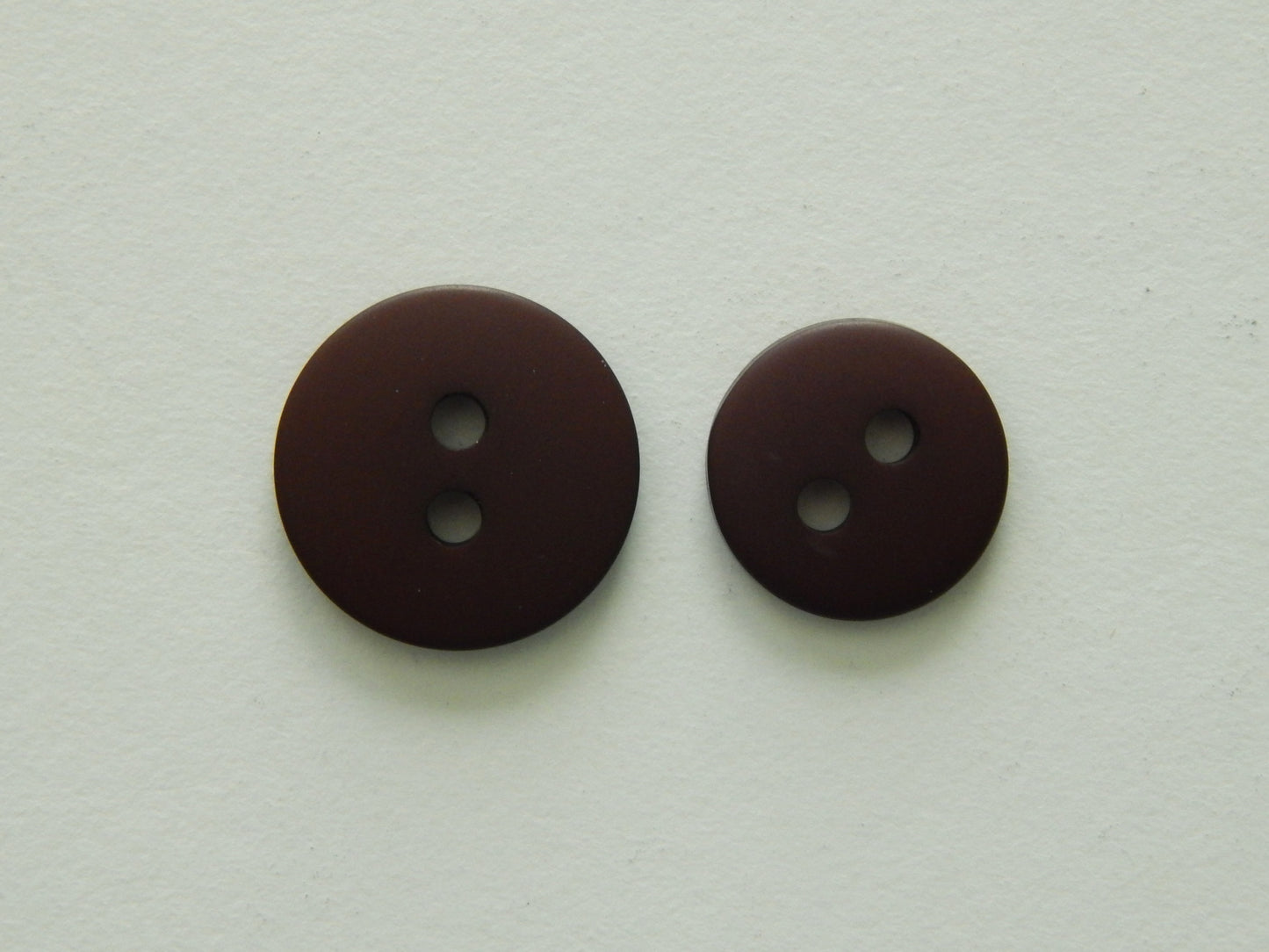 dark brown plastic buttons