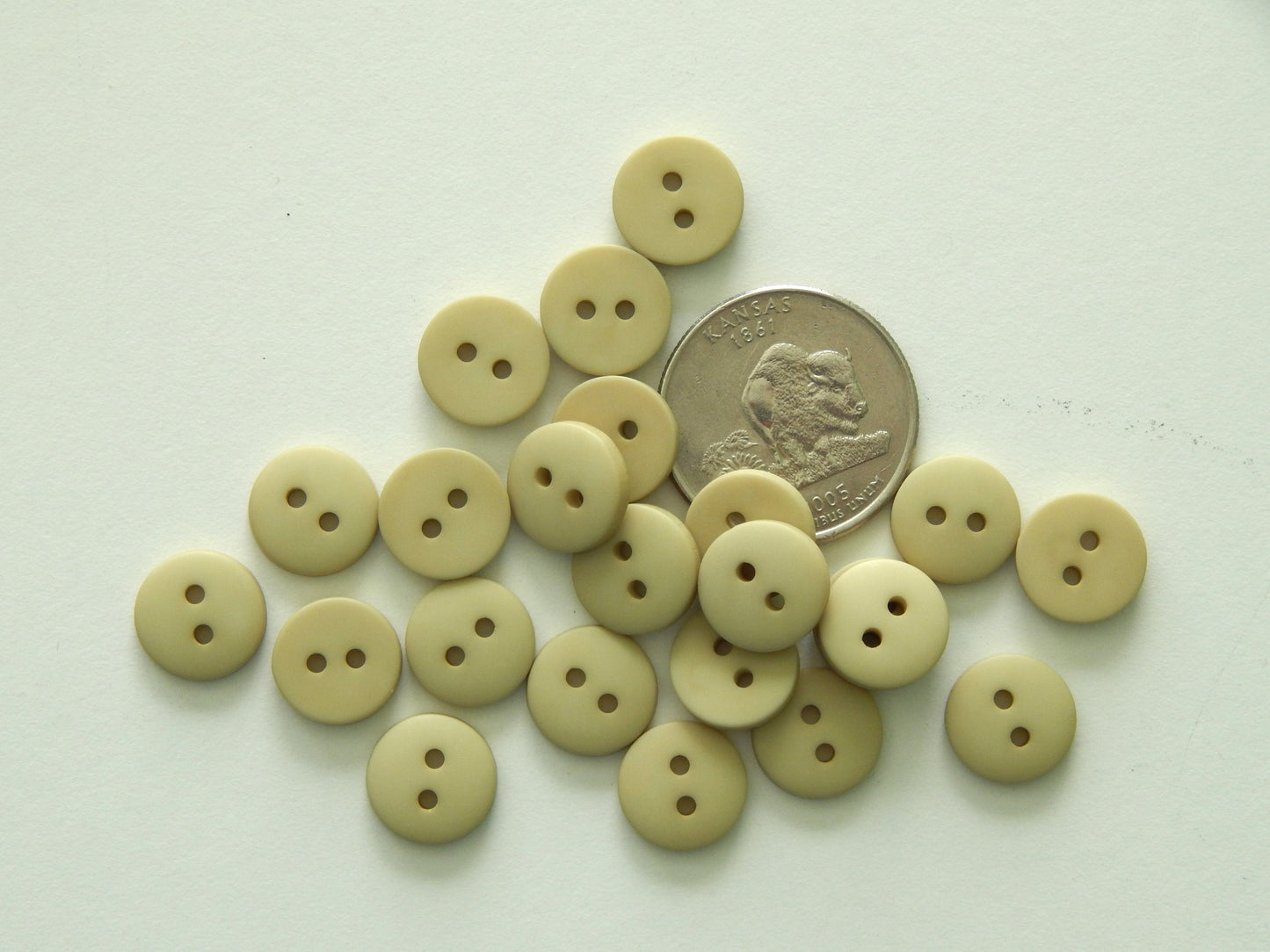 light tan plastic buttons