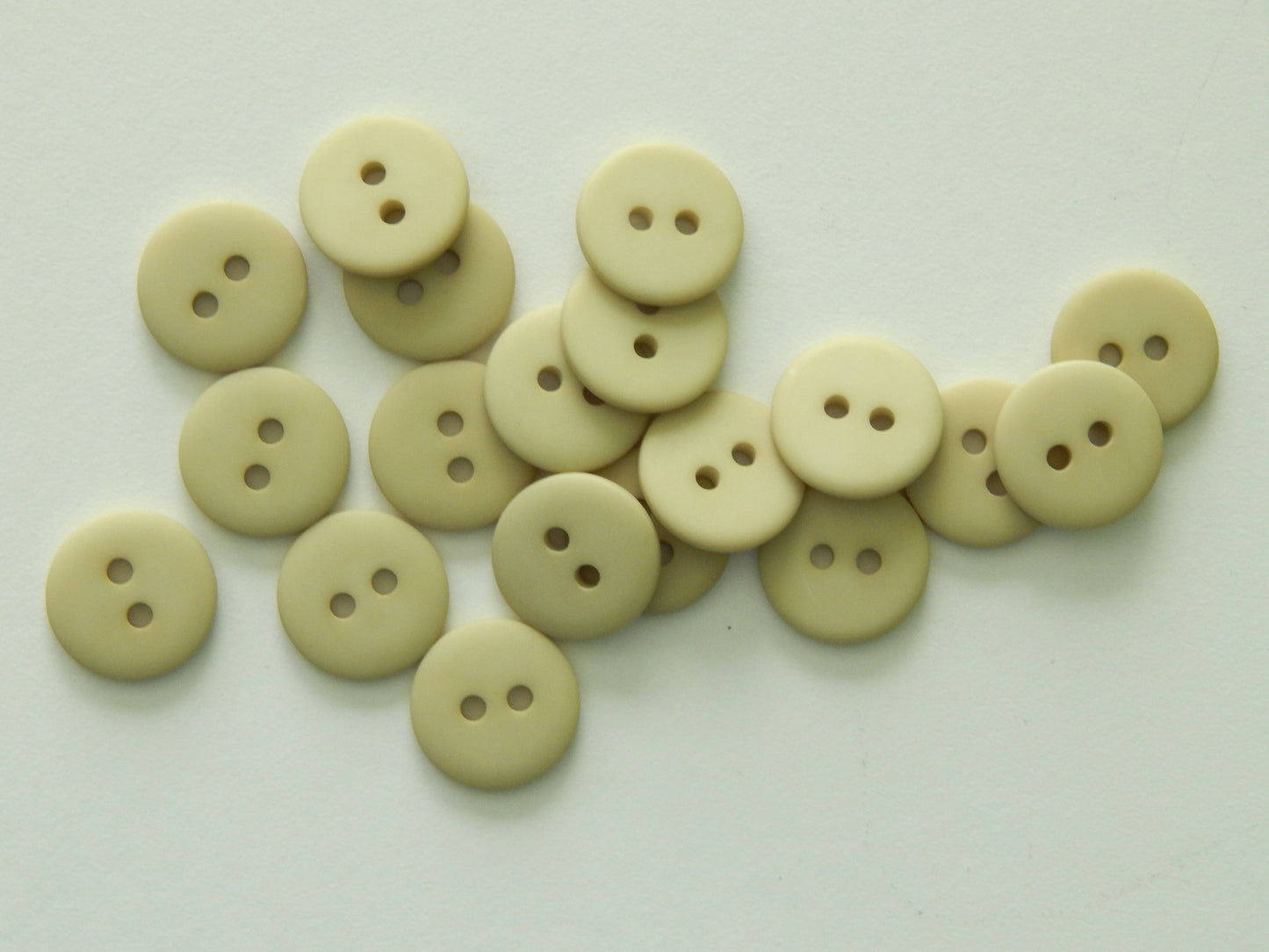 light tan polyester shirting buttons