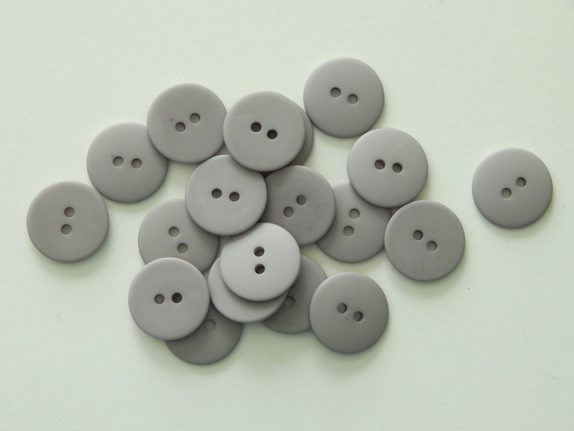 solid gray plastic button