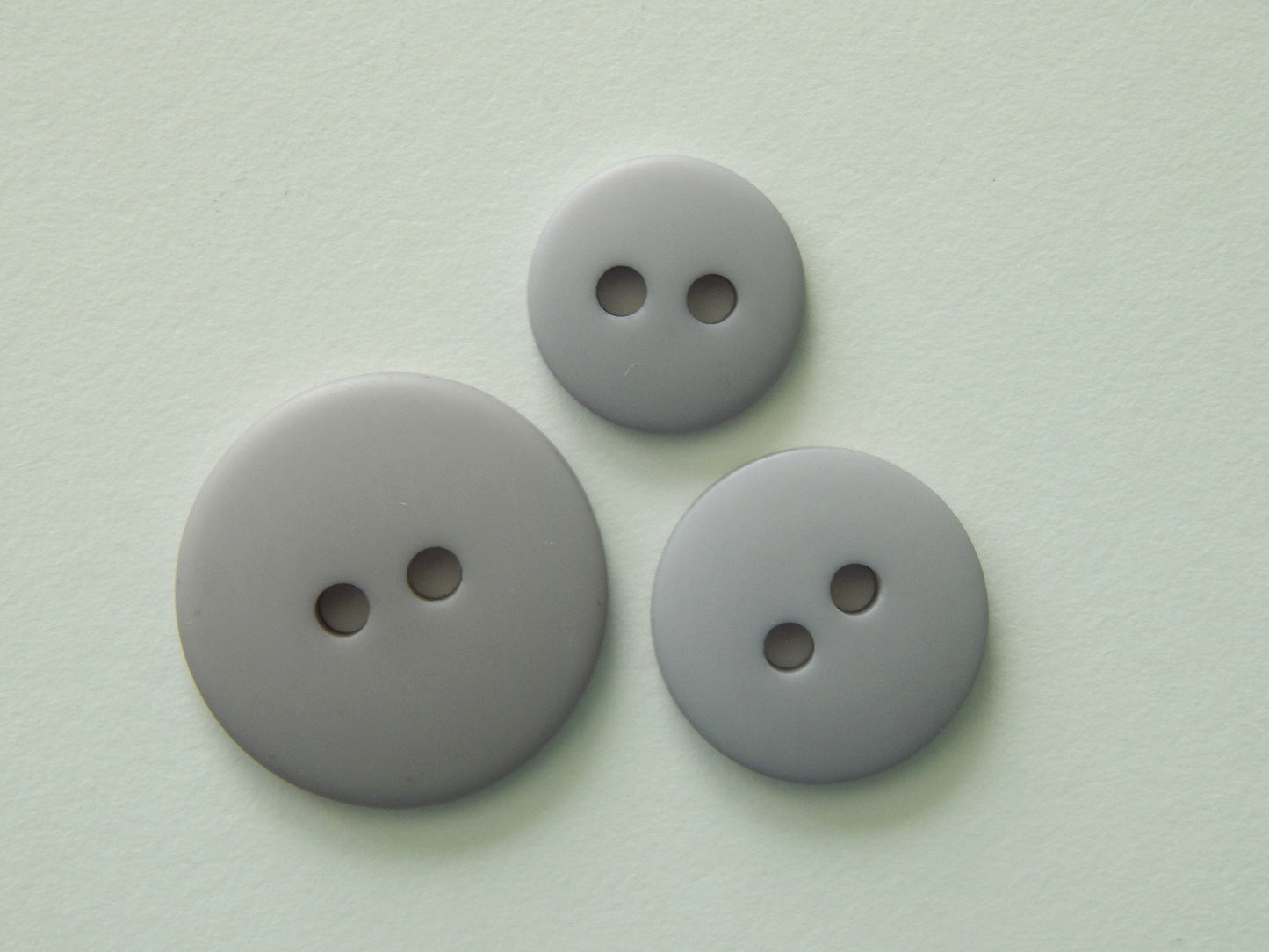 gray plastic buttons