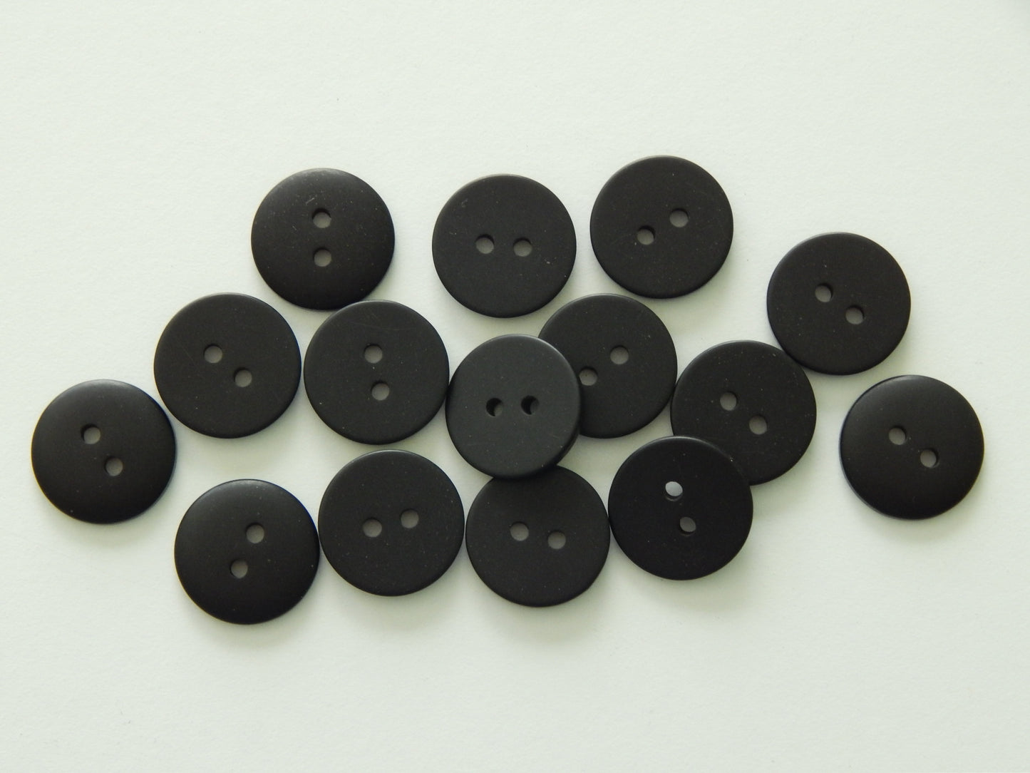 black plastic buttons