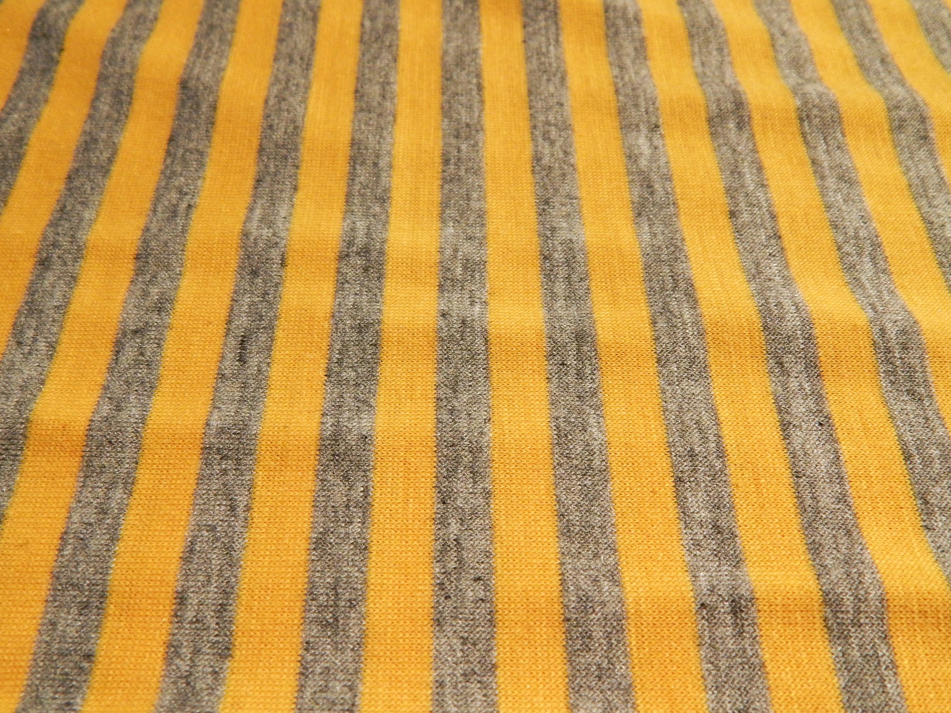 gold and heathered grey jersey knit fabric