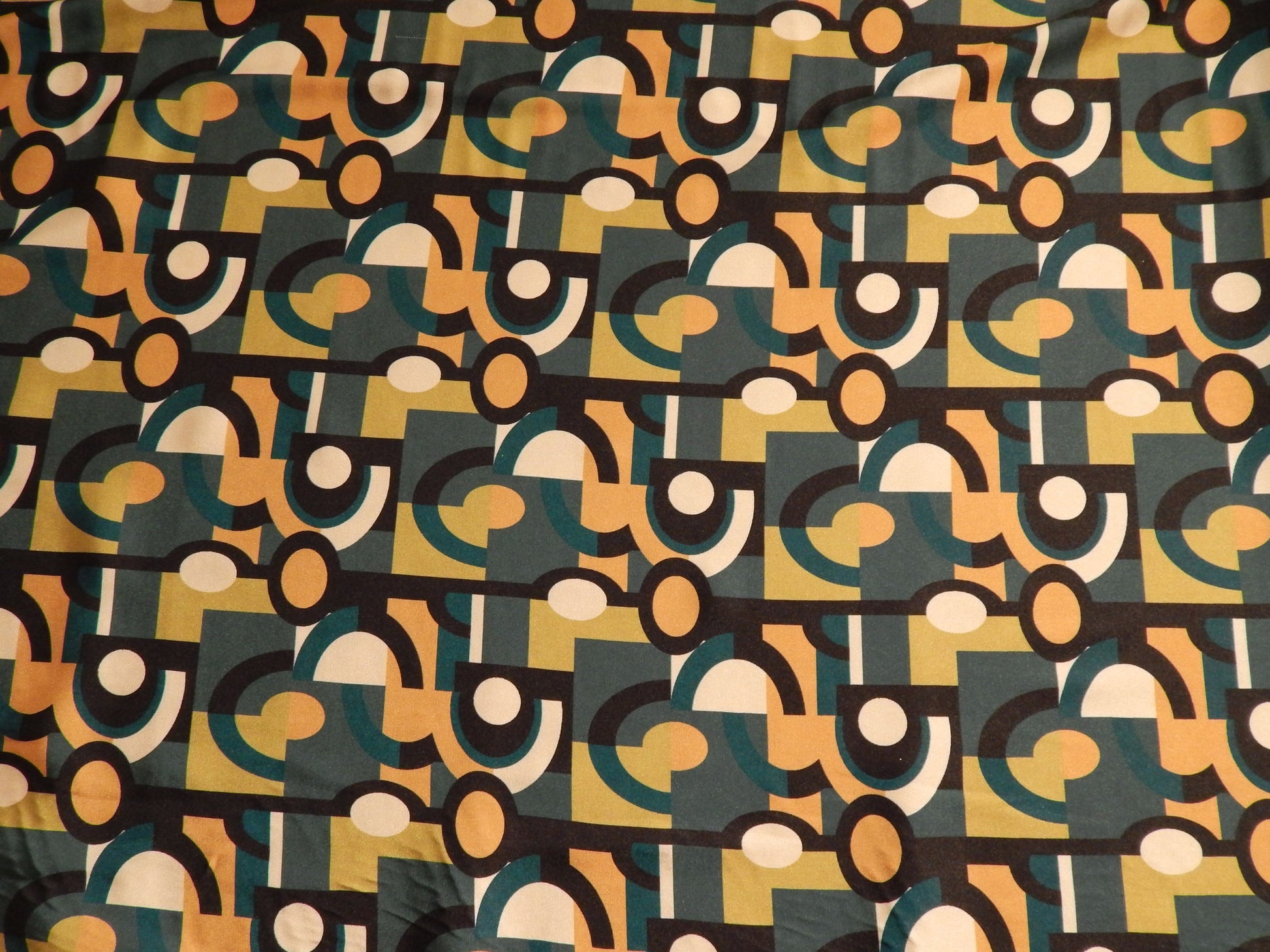 olive and teal and orange abstract eyes fabric