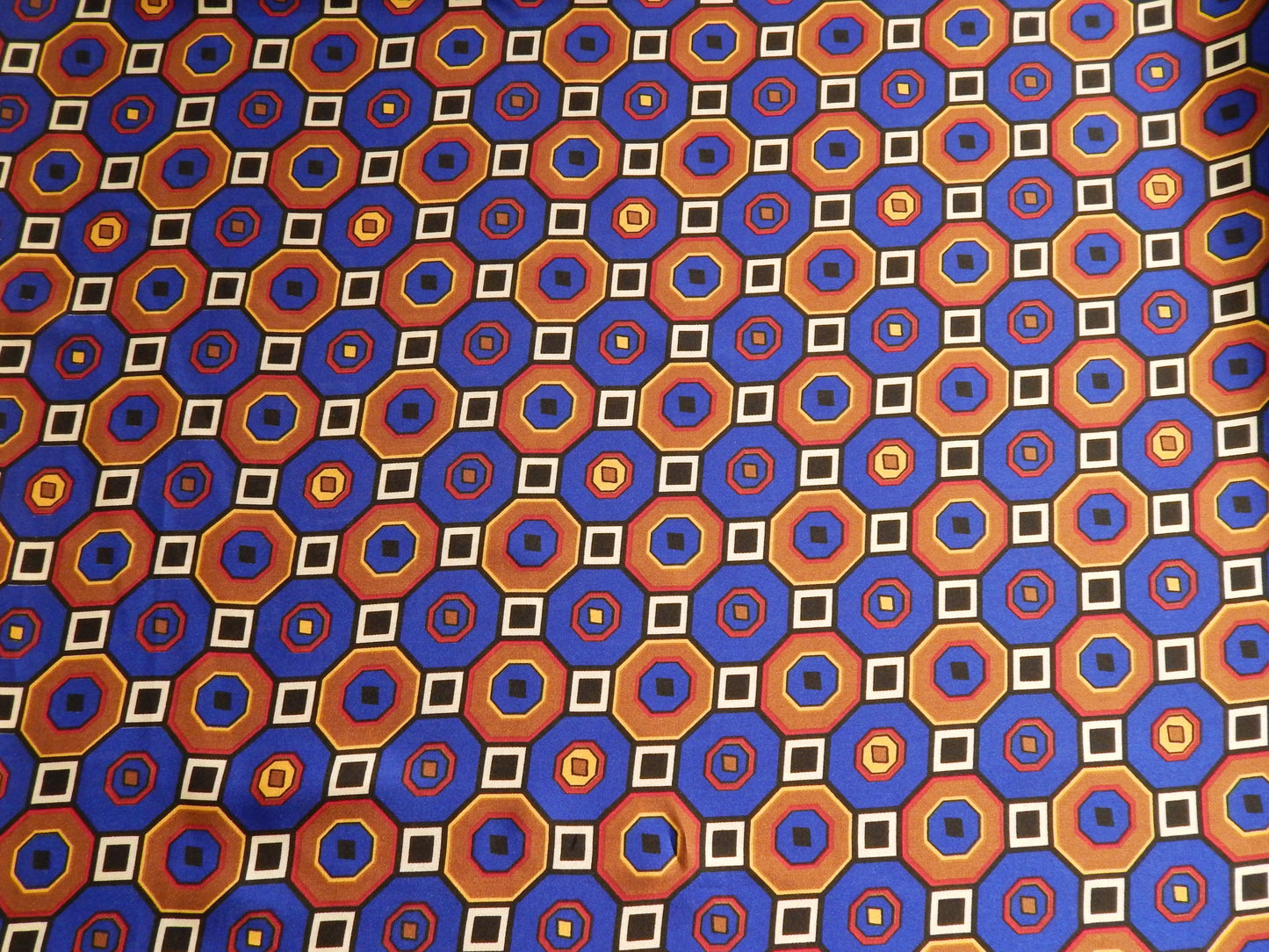 geometric illusion blue and gold silk fabric