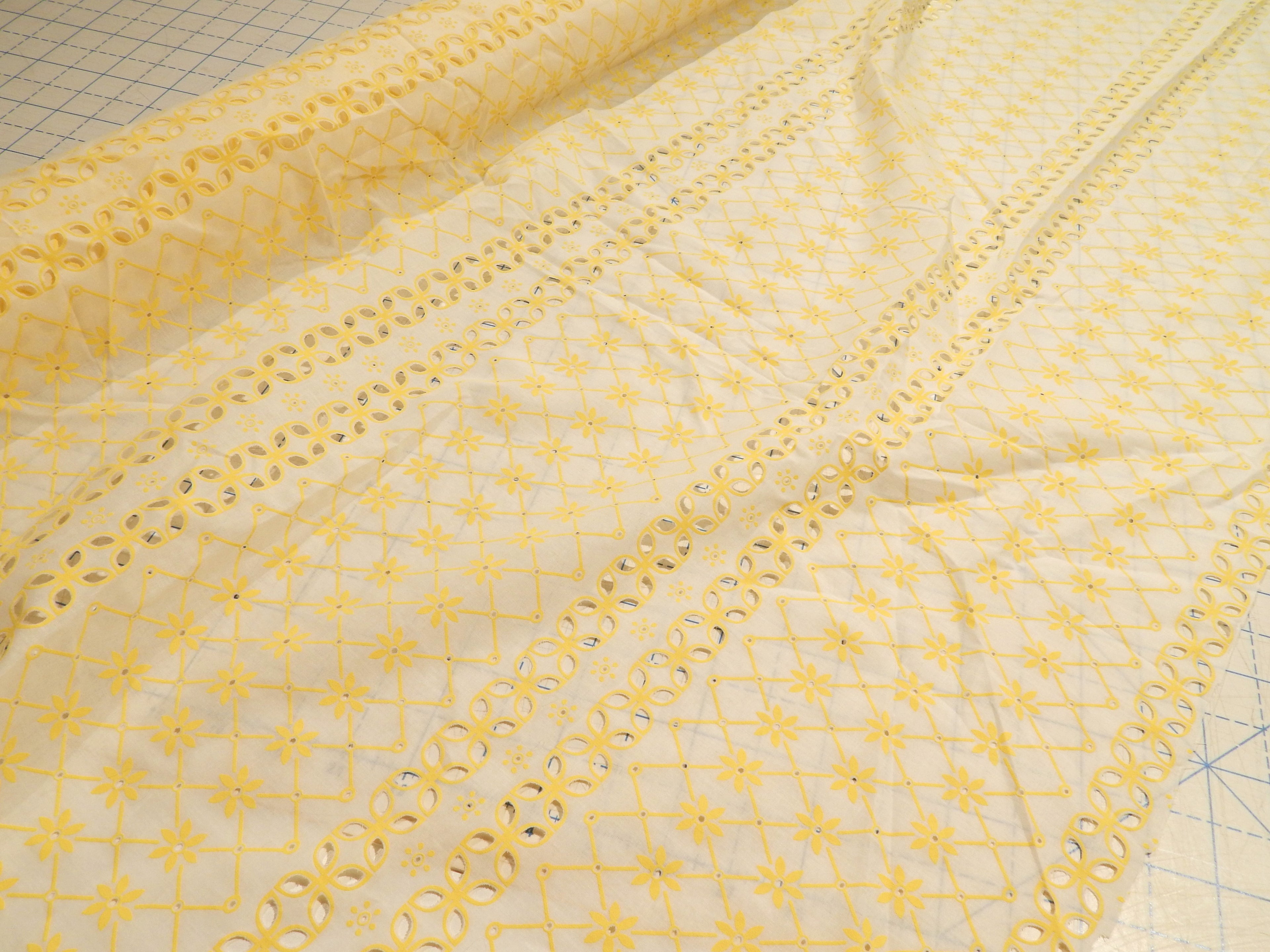 yellow and white cotton eyelet fabric